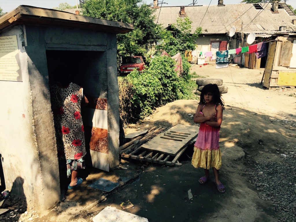 Roma collecting water from the town's only faucet, installed by Doug and his church